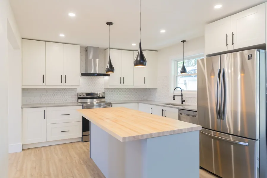 Donaldson Avenue — A tired house taken back to the studs and rebuilt: new kitchen, new baths, new stair. Designed by MAD Design Interiors in Halifax.